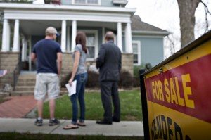 The housing recovery slowed during 2014 and shows few signs of breaking out or slowing sharply during the new year. Here, a house hunt plays out in Mackinaw, Ill., last year. Bloomberg News 